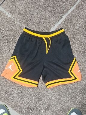 Jordan Black Basketball Shorts with Orange Panels and Yellow Trim
